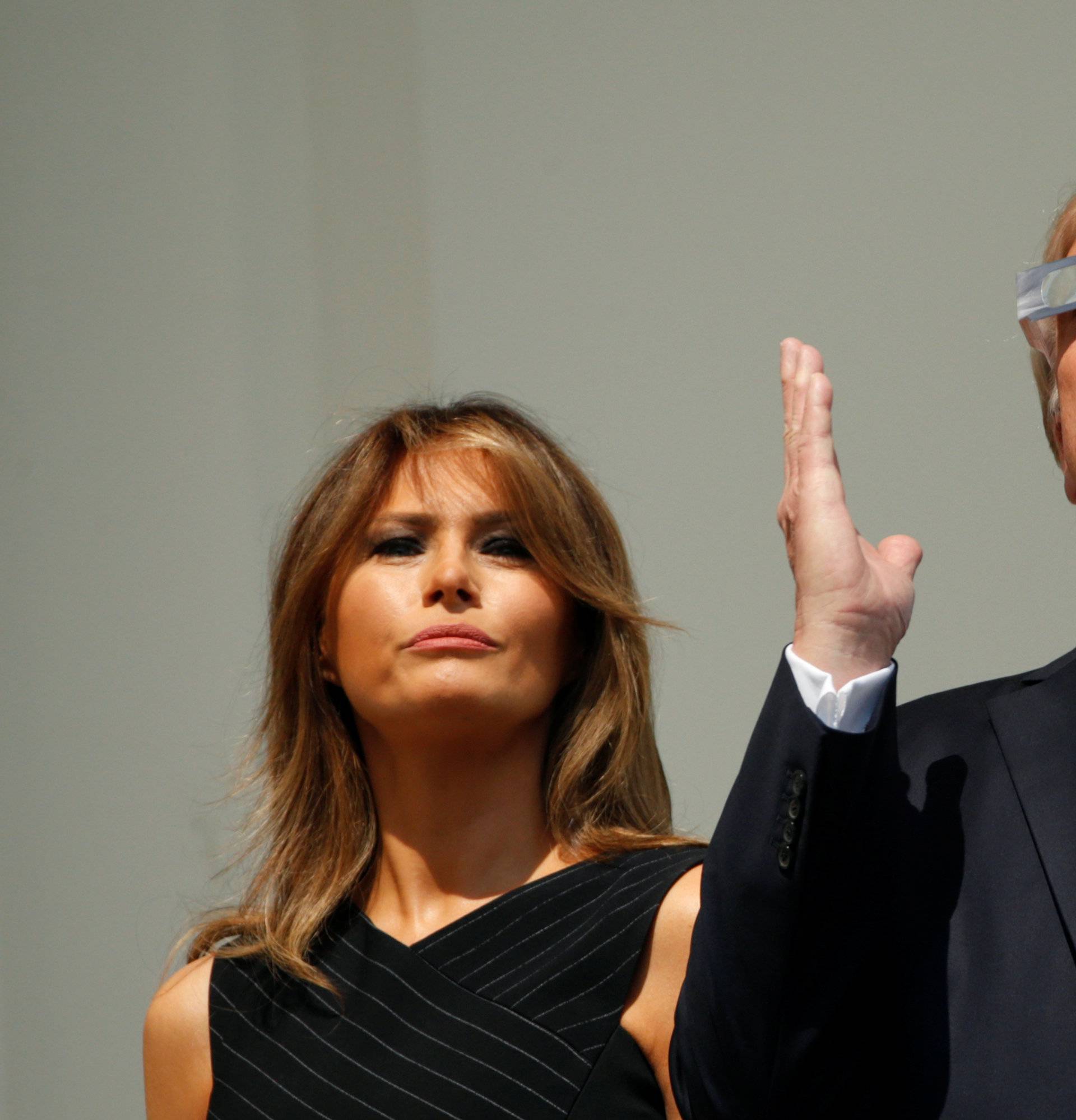 U.S. President Trump and Melania Trump watch the solar eclipse from the White House in Washington