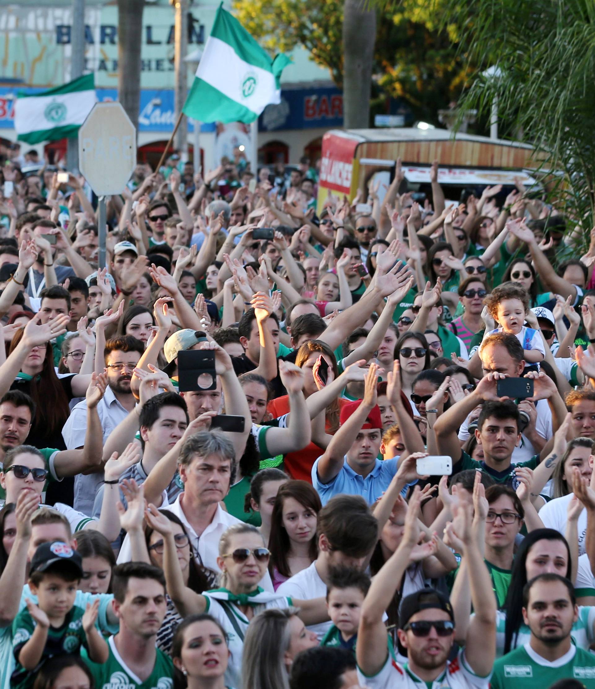 Fans of Chapecoense soccer team gather the streets in tribute of their players in Chapeco