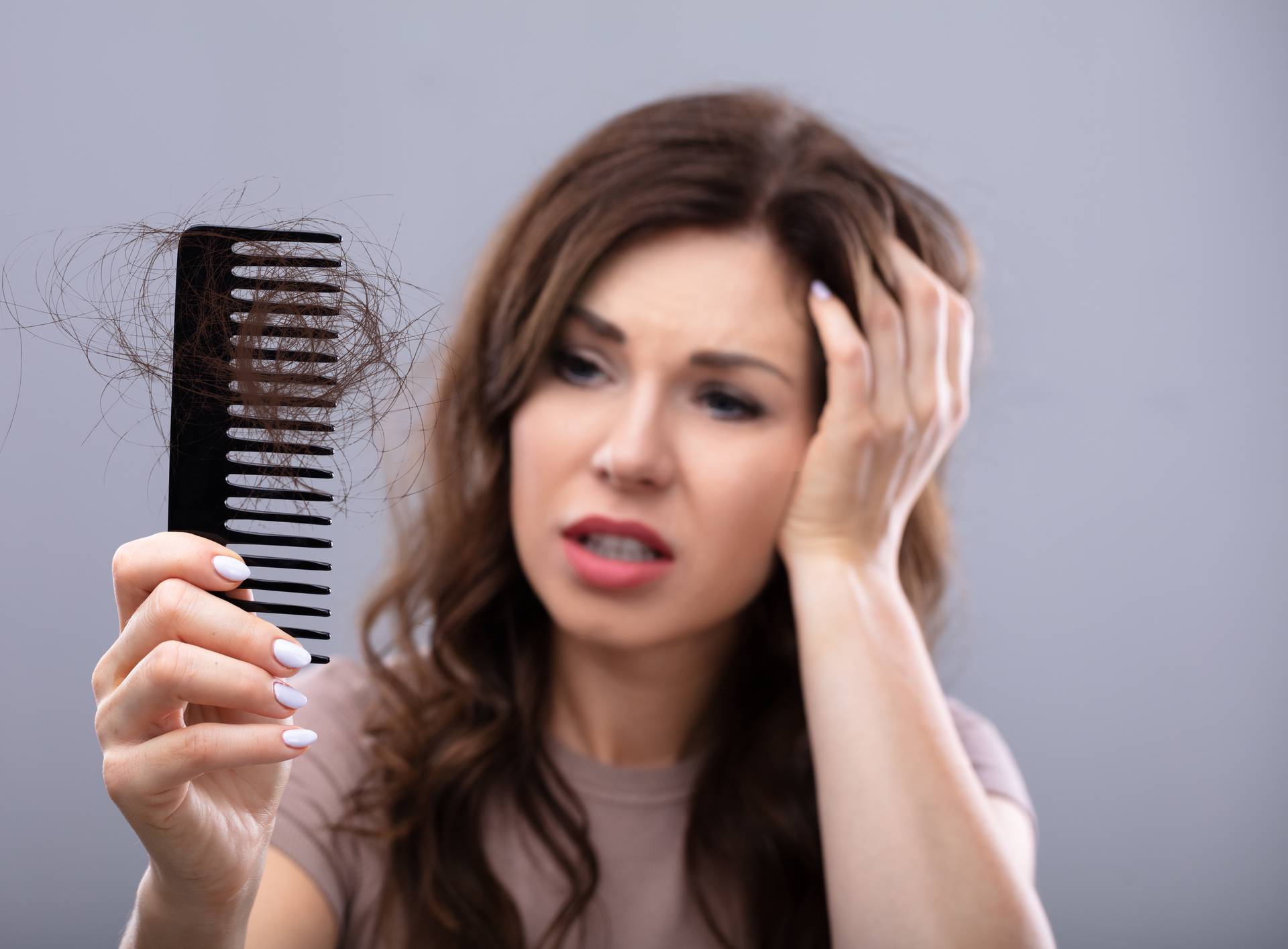 Worried Woman Suffering From Hairloss