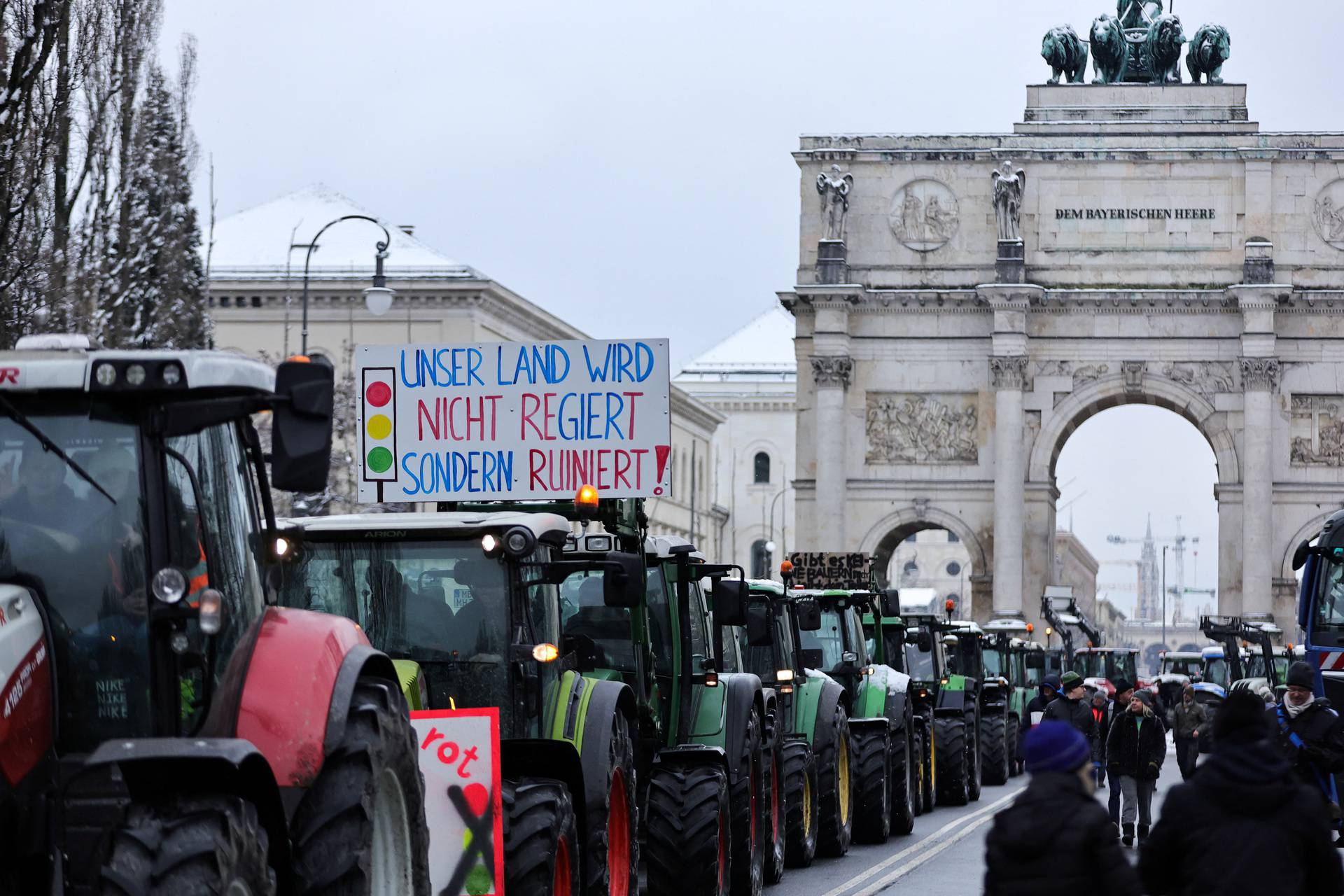 German farmers take part in a protest against the cut of vehicle tax subsidies