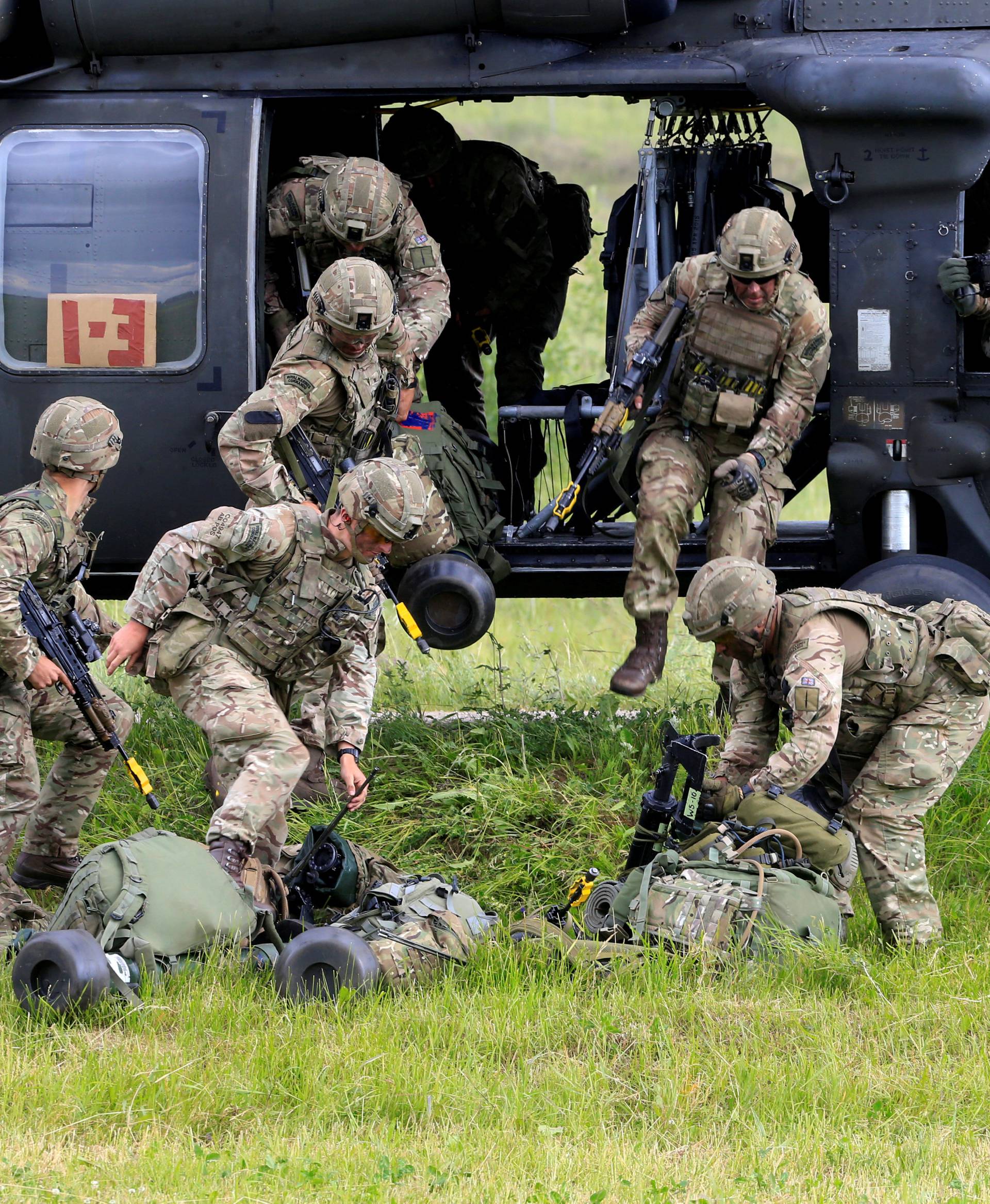 FILE PHOTO: U.S. army soldiers leave Black Hawk helicopter during Suwalki gap defence exercise in Mikyciai