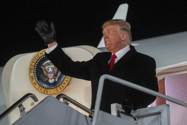 U.S. President Donald Trump waves upon arriving aboard Air Force One at W.K. Kellogg Airport in Battle Creek, Michigan