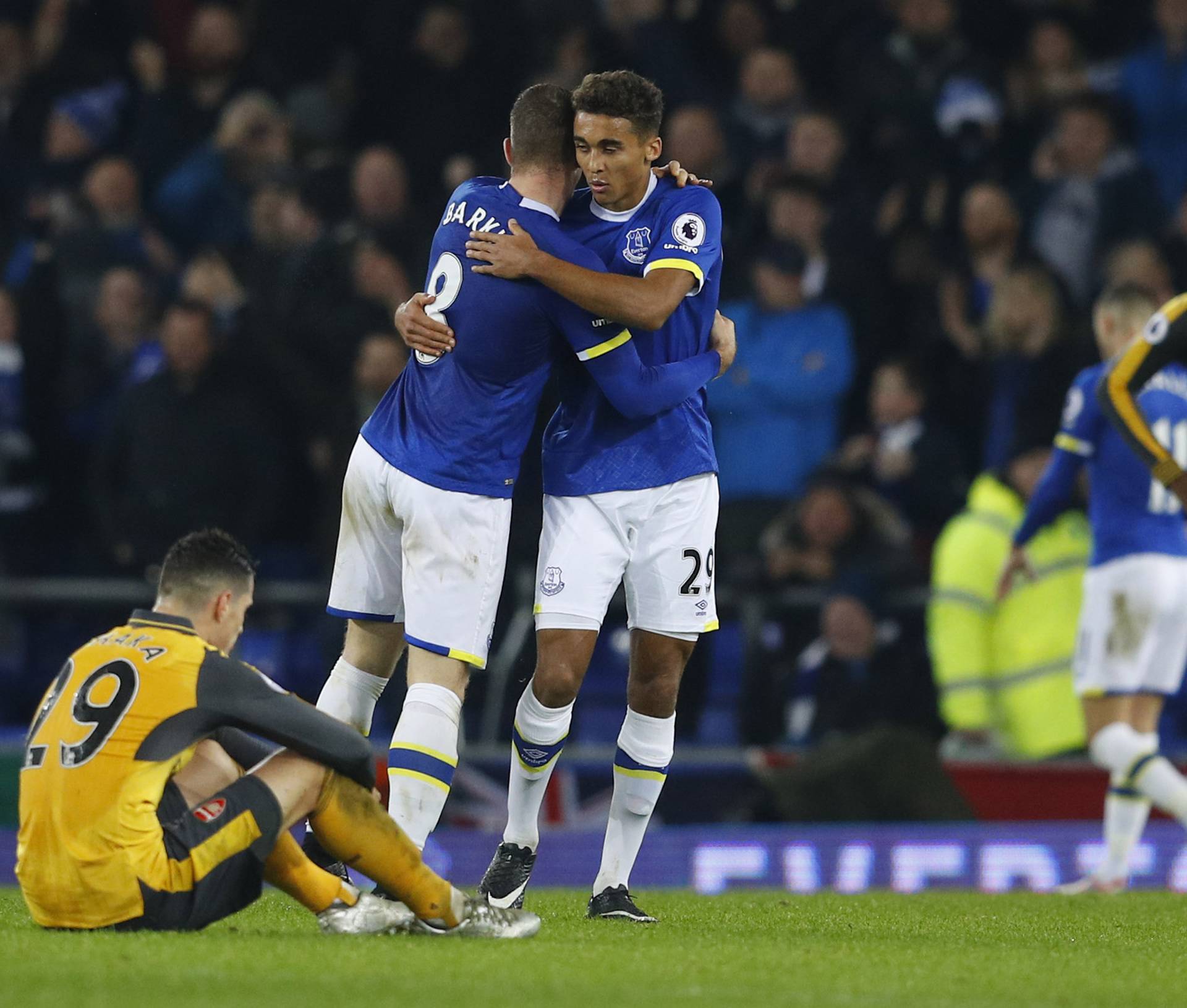 Everton's Dominic Calvert-Lewin and Ross Barkley celebrate after the game as Arsenal's Granit Xhaka looks dejected