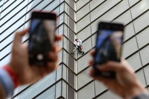 Alain Robert climbs Heron Tower