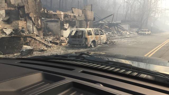 Burned buildings and cars aftermath of wildfire in Gatlinburg Tennessee