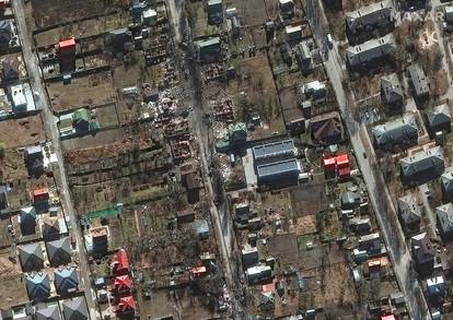 A satellite image shows destroyed military vehicles in a residential area and destroyed homes on Vokzalna Street, in Bucha