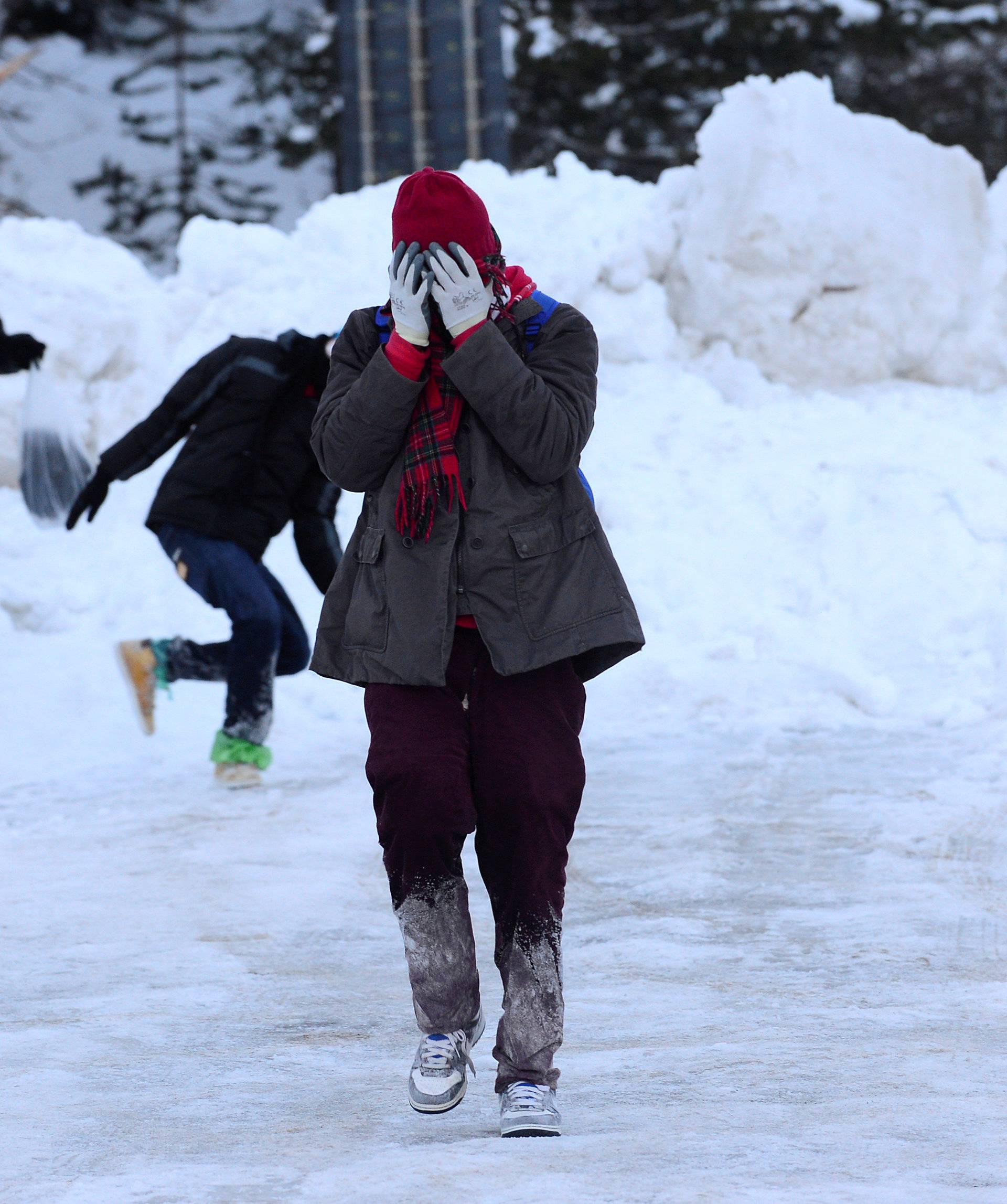 Migrants walk in the snow after failing to cross from Italy to France due to too much snow on the mountain, in Bardonecchia