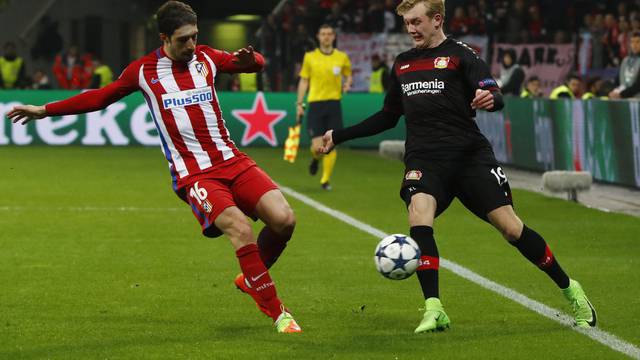Bayer Leverkusen's Julian Brandt in action with Atletico Madrid's Sime Vrsaljko