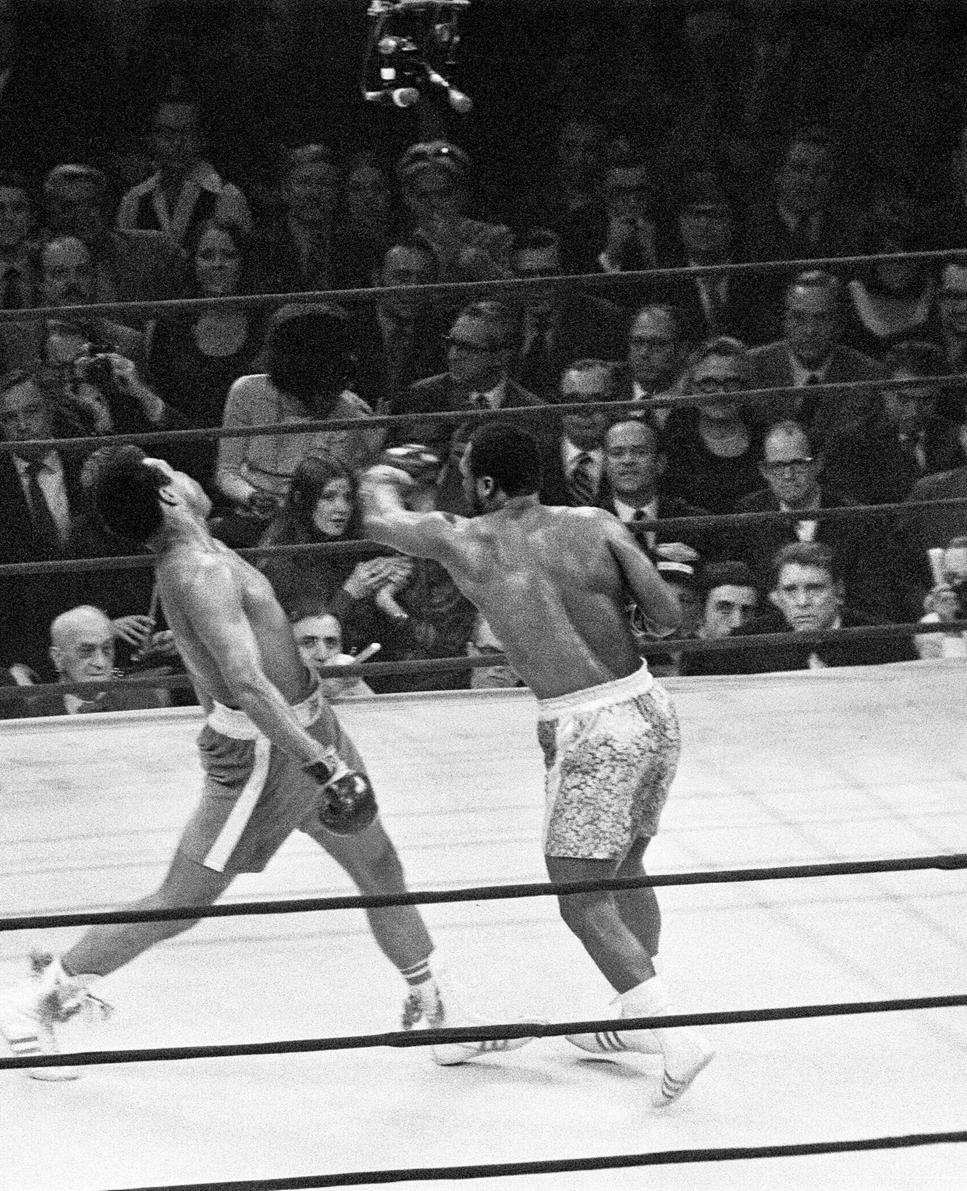  Joe Frazier (R) lands a left hook on Muhammad Ali during the first of their three epic battles at Madison Square Garden in New York City