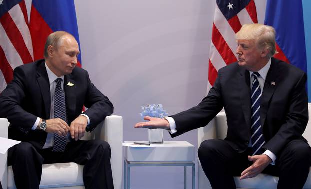 FILE PHOTO: U.S. President Donald Trump meets with Russian President Vladimir Putin during their bilateral meeting at the G20 summit in Hamburg