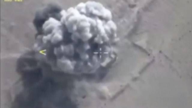 A still image shows airstrikes hitting what the Defence Ministry says was an Islamic State target in Deir al-Zor province