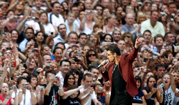 FILE PHOTO: British pop star George Michael performs during a concert at Wembley Stadium in London