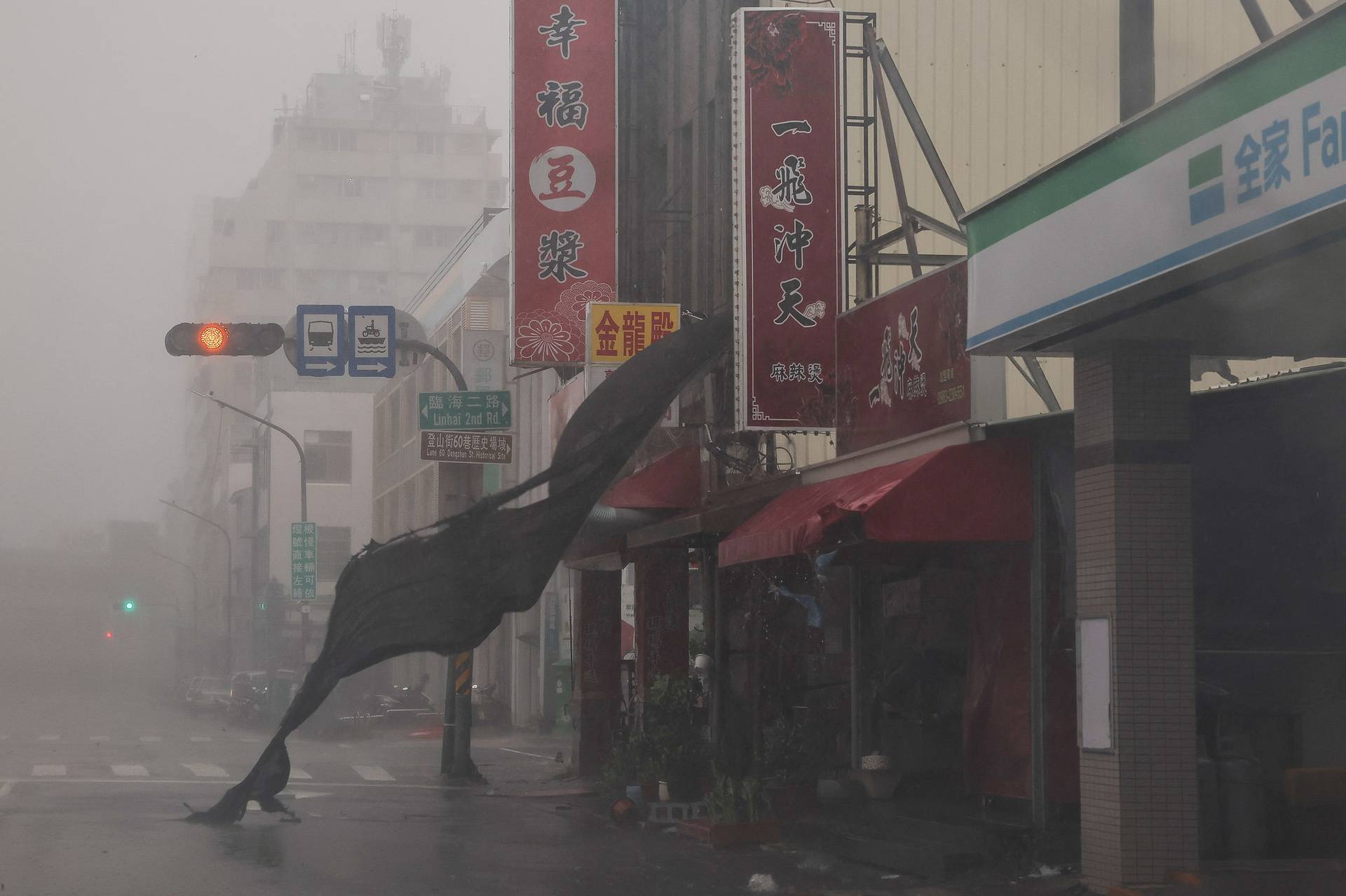 A view shows an empty street with heavy rain and wind as Typhoon Krathon approaches, in Kaohsiung