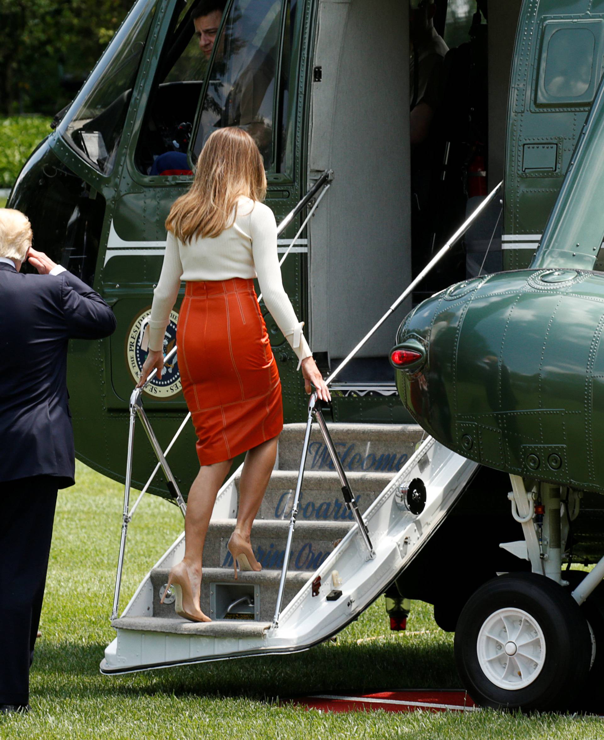 Melania Trump and U.S. President Trump board Marine One to embark on a trip to the Middle East and Europe, at the White House in Washington