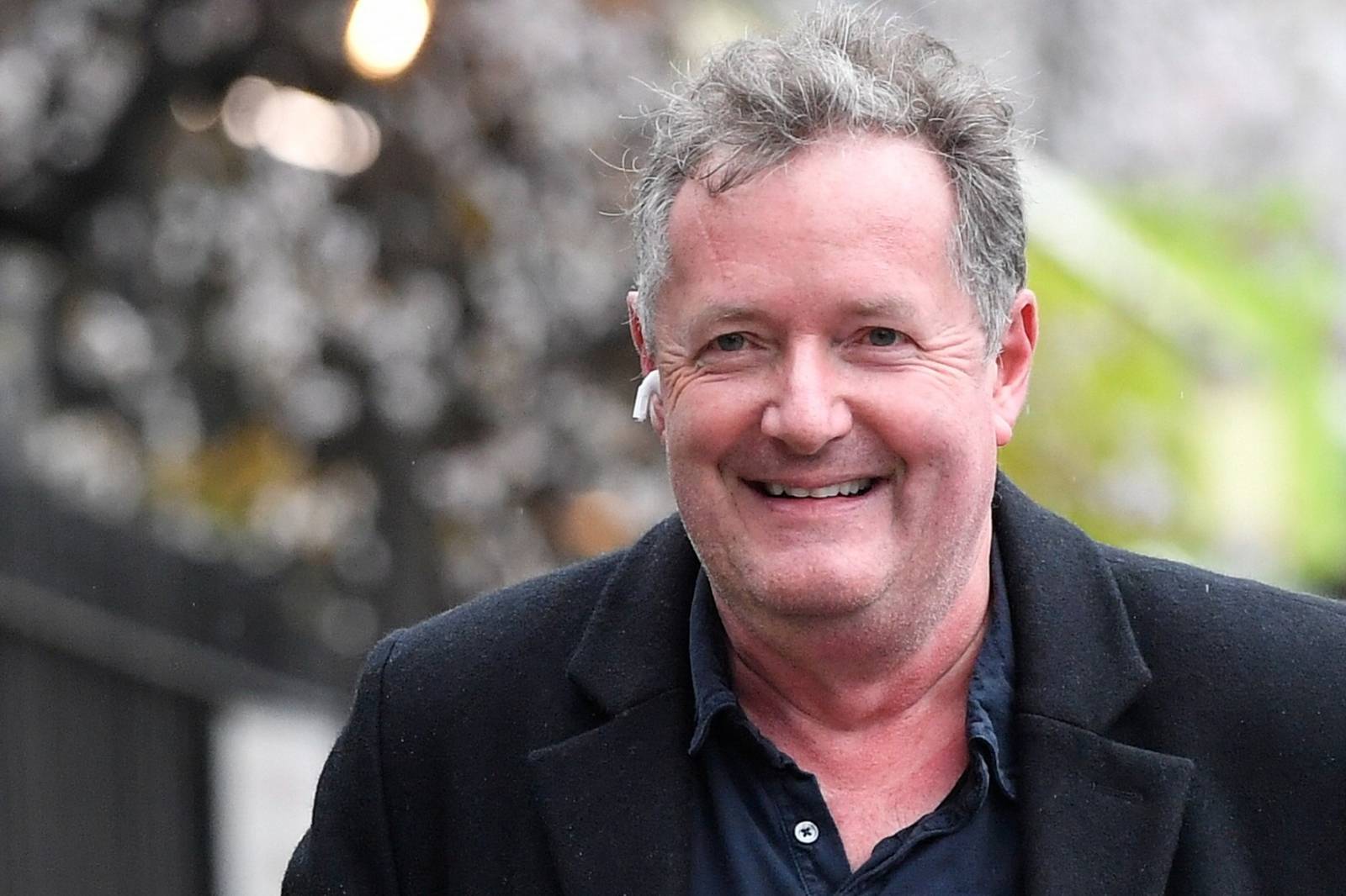 Piers Morgan walks near his house in London