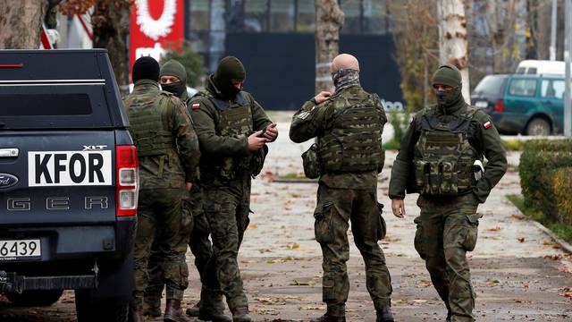 Polish KFOR soldiers patrol in North Mitrovica