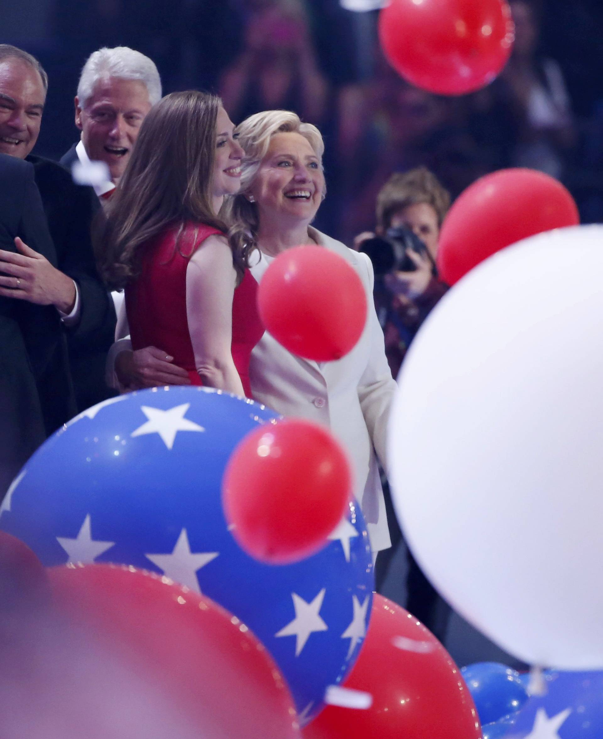 Democratic presidential nominee Hillary Clinton enjoys the balloon drop with her husband former president Bill Clinton and daughter Chelsea Clinton at the Democratic National Convention in Philadelphia, Pennsylvania