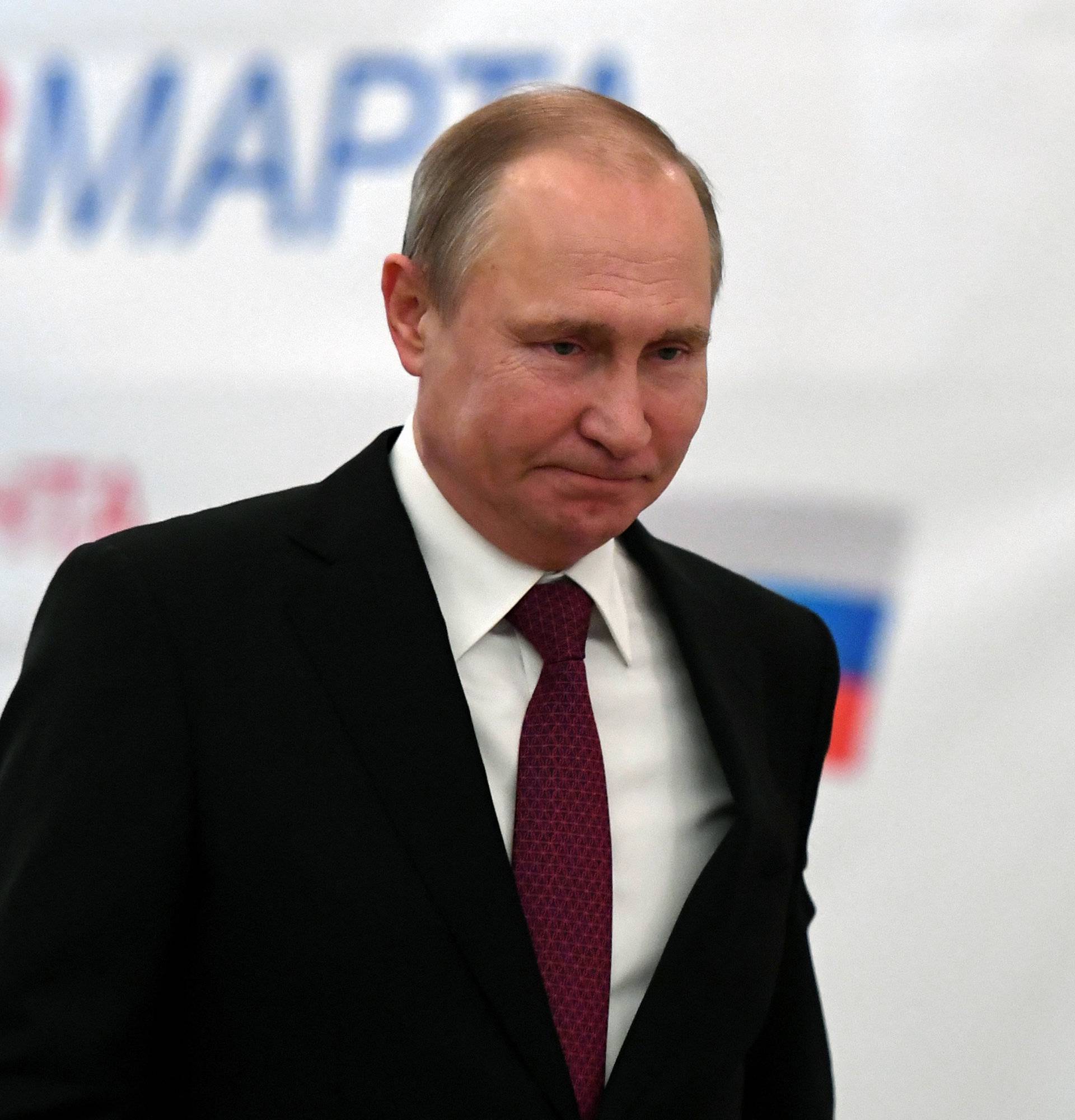 Russian President and Presidential candidate Vladimir Putin at a polling station during the presidential election in Moscow