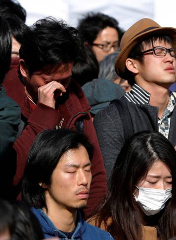 Participants observe a moment of silence at 2:46 p.m. (0546 GMT), the time when the magnitude 9.0 earthquake struck off Japan's coast in 2011, during a rally in Tokyo