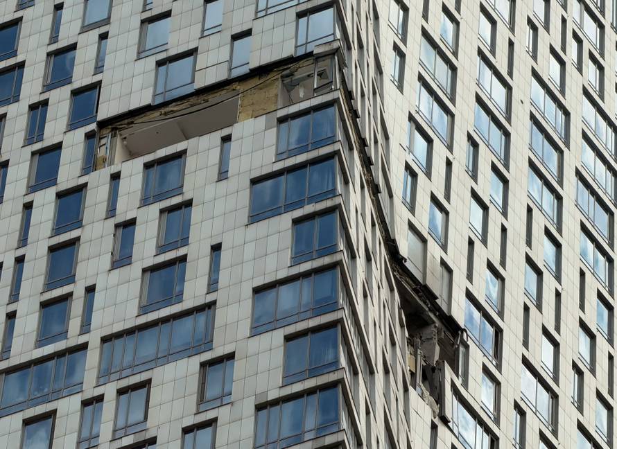 The damaged facade of a high-rise building following a drone attack, amid the Russia-Ukraine conflict, in Moscow