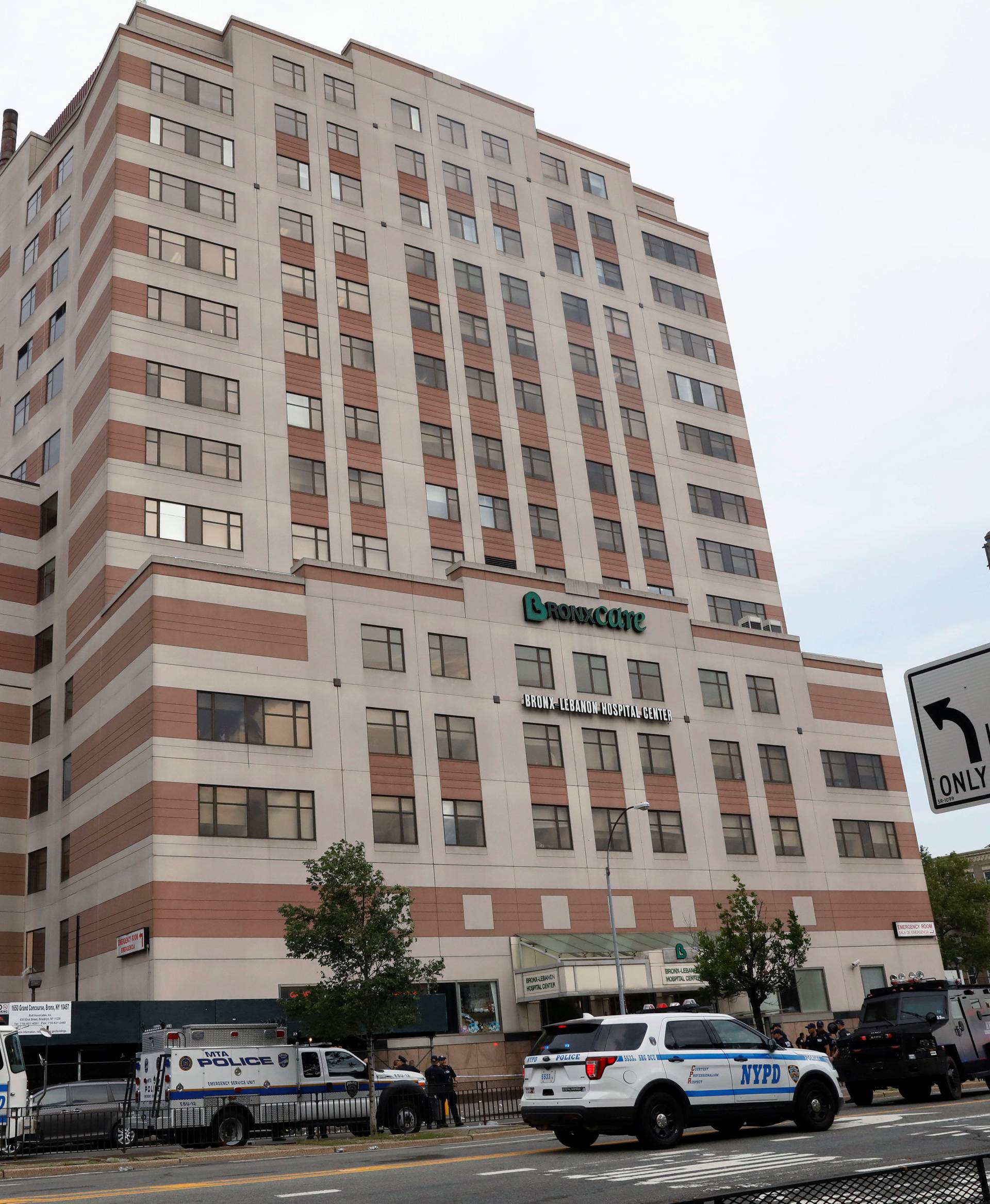 NYPD officers work outside Bronx-Lebanon Hospital, after an incident in which a gunman fired shots inside the hospital, in New York