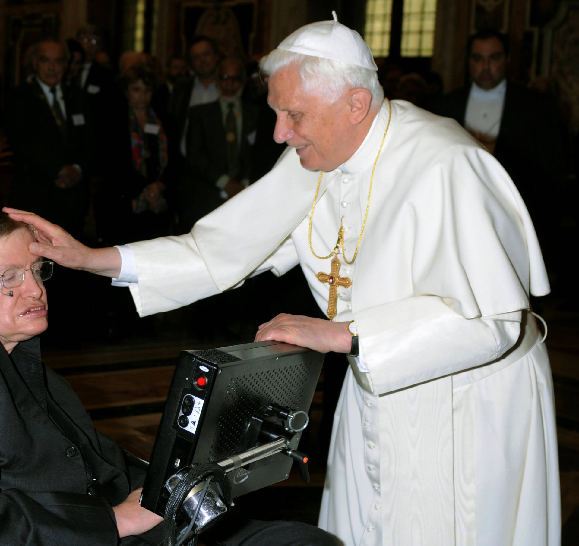 FILE PHOTO: Pope Benedict XVI greets British professor Hawking during a meeting of science academics at the Vatican