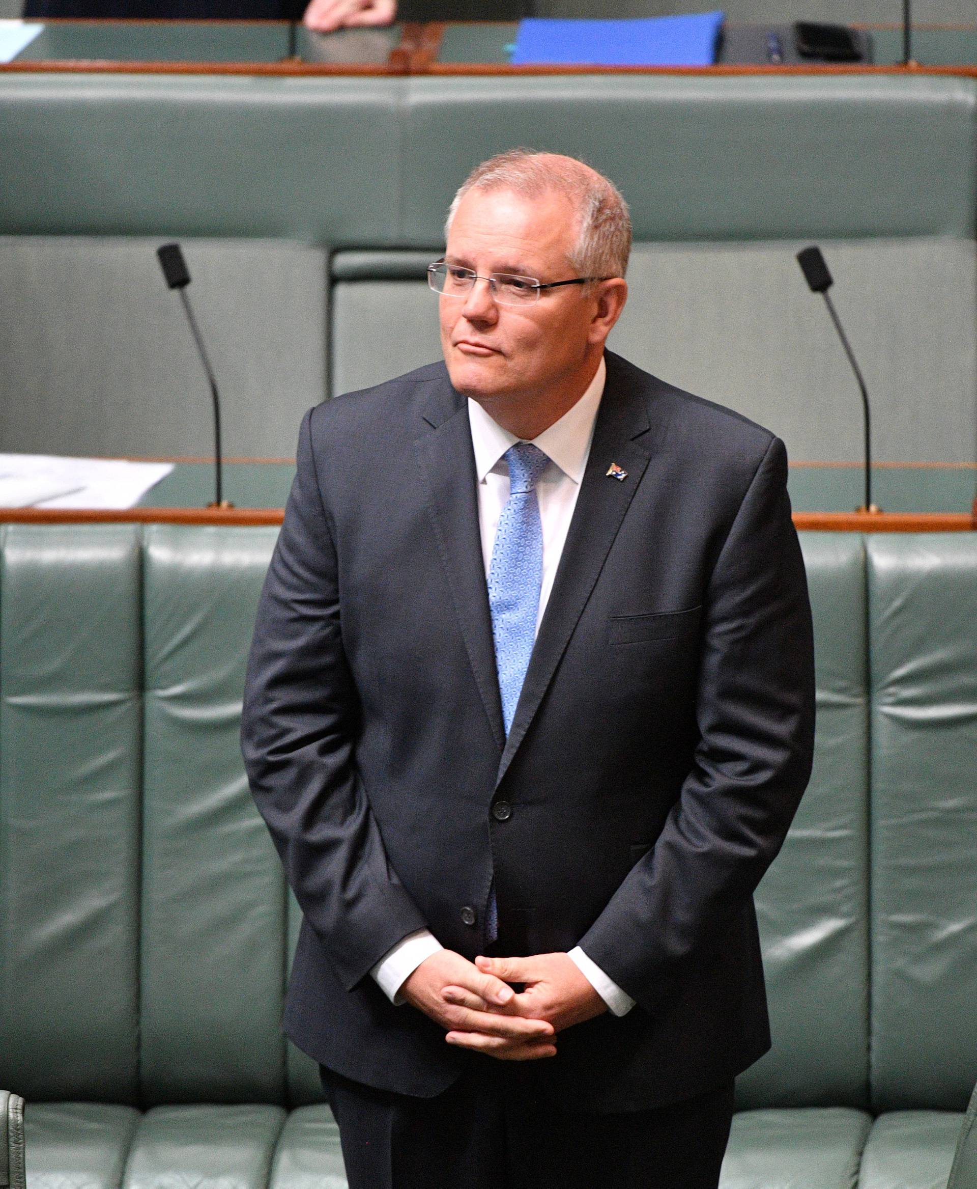 Australia's Prime Minister Scott Morrison stands before delivering the National Apology in Canberra