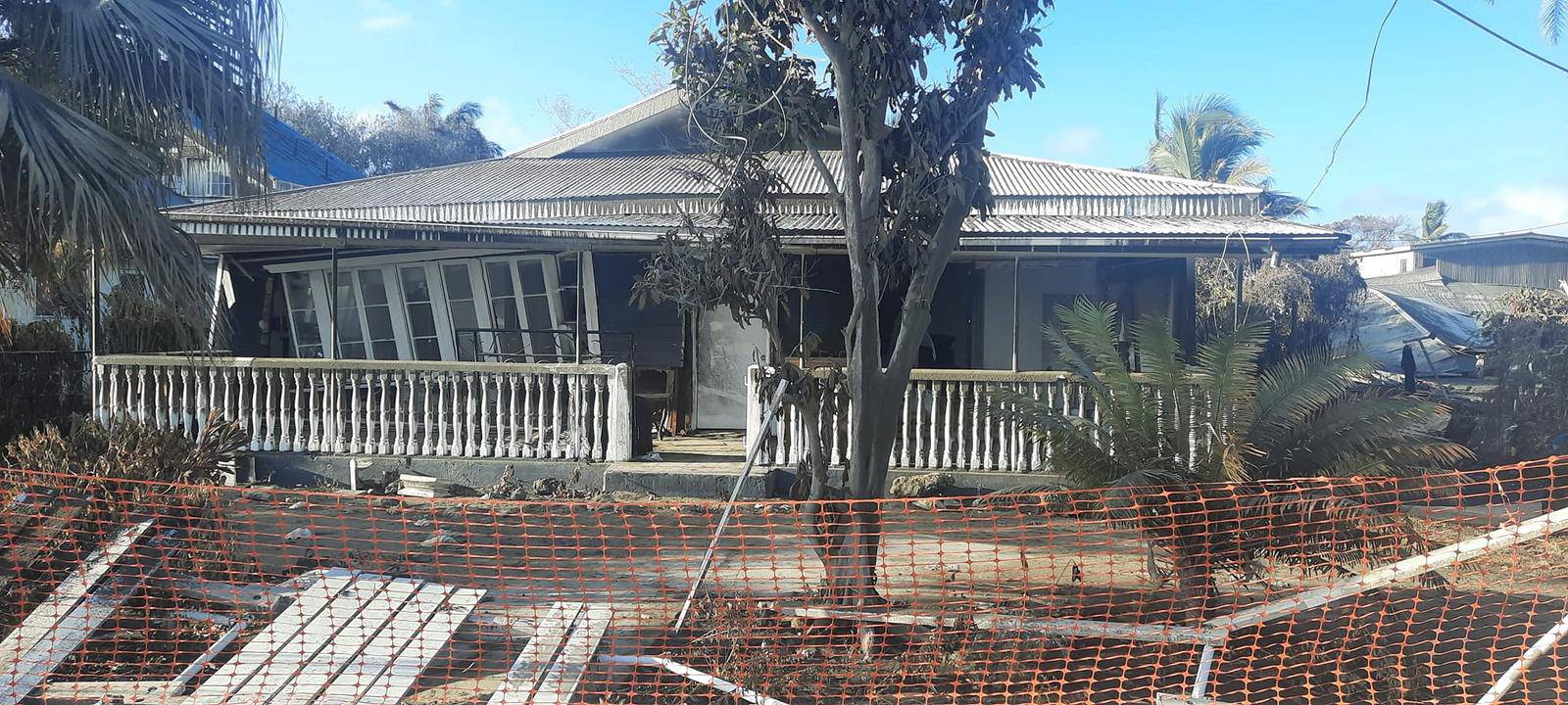 Damaged buildings following volcanic eruption and tsunami, in Nuku'alofa