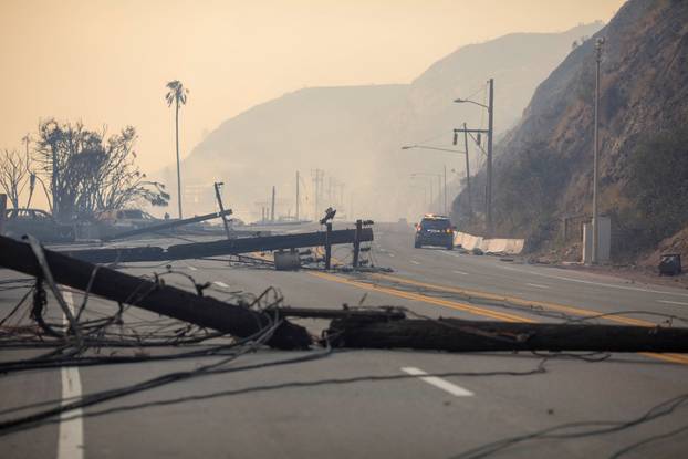 Palisades fire burns during a windstorm on the west side of Los Angeles