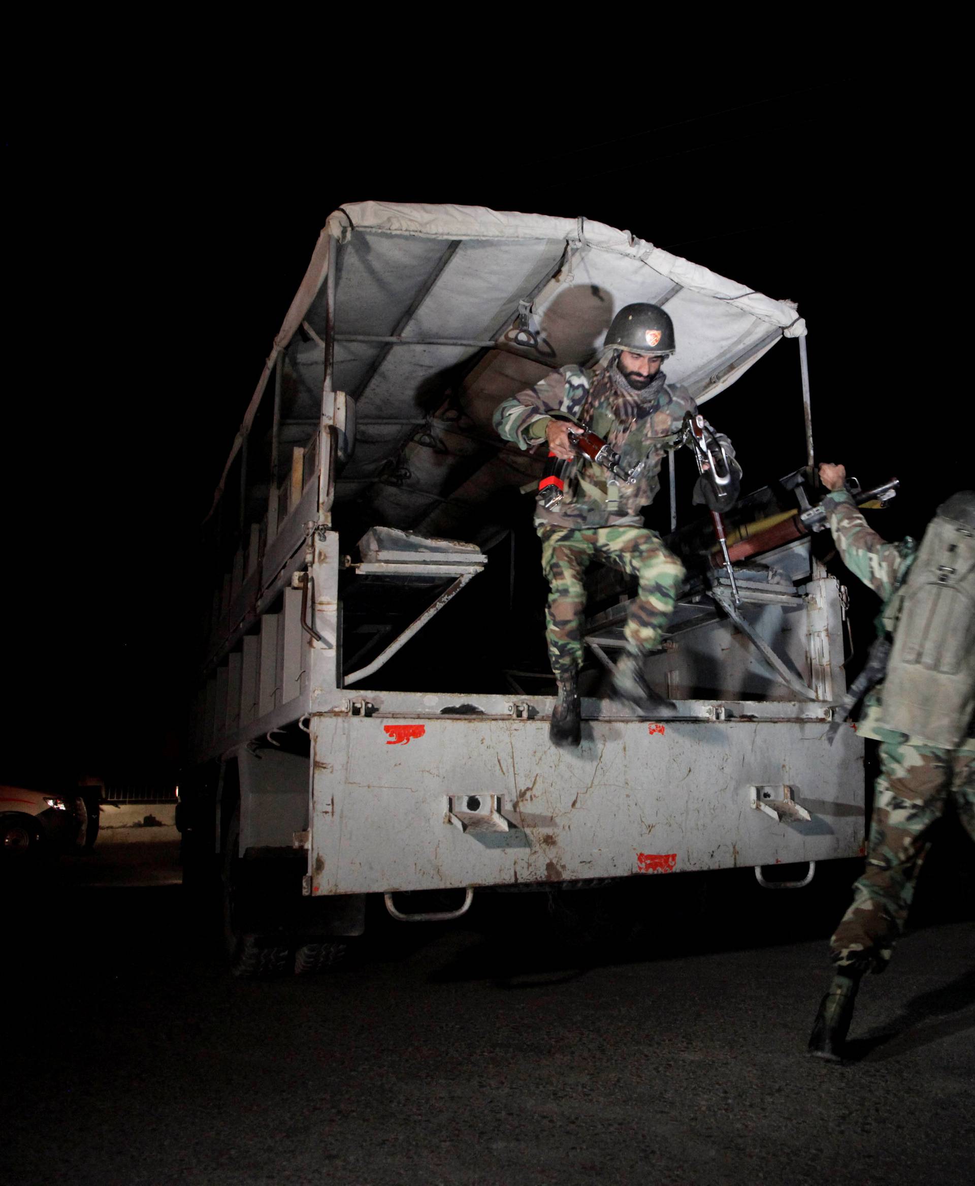 Pakistani troops deploy outside the Police Training Center after an attack on the center in Quetta