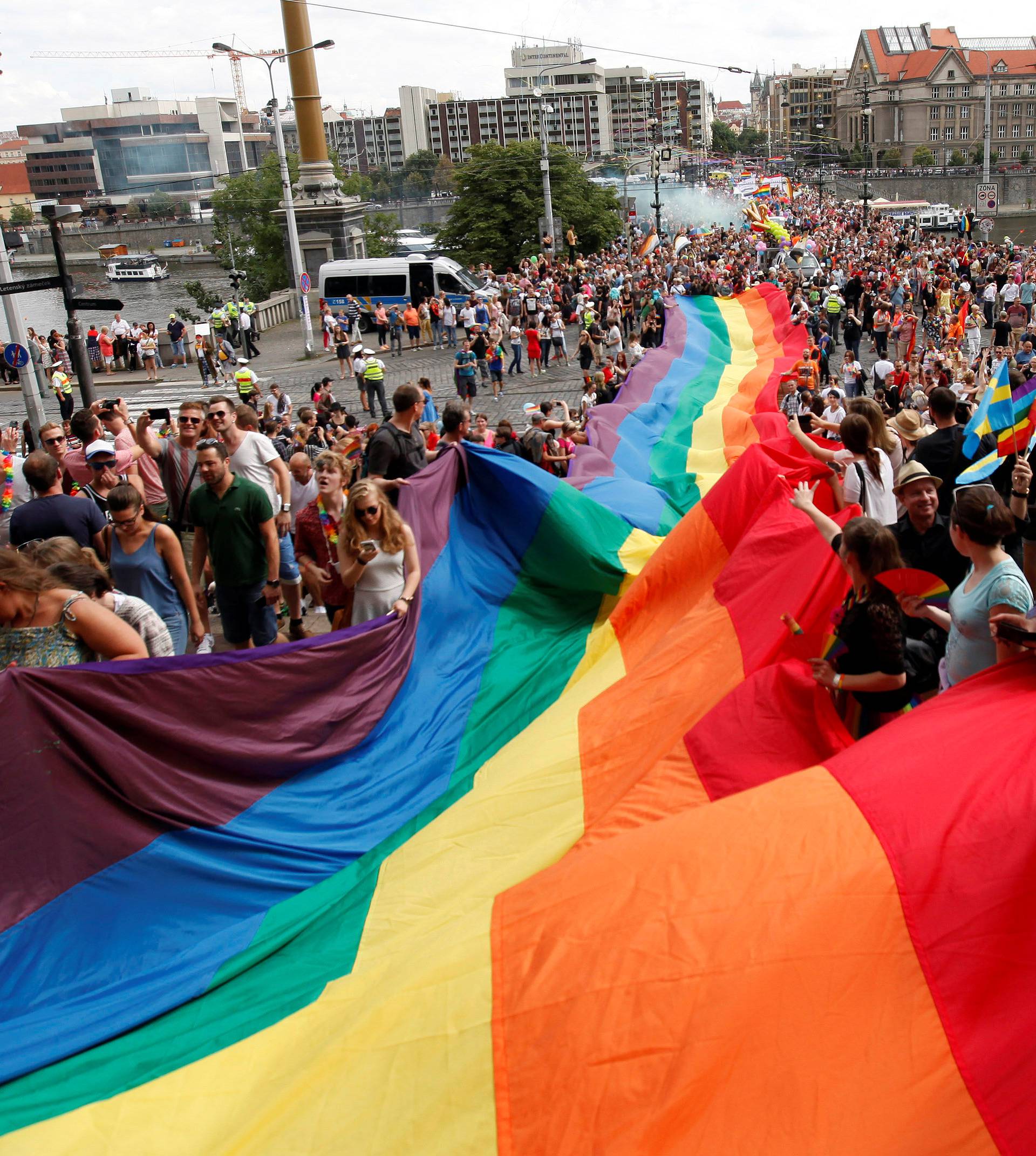 Participants hold a giant rainbow flag during the Prague Pride Parade where thousands marched through the city centre in support of gay rights, in Czech Republic