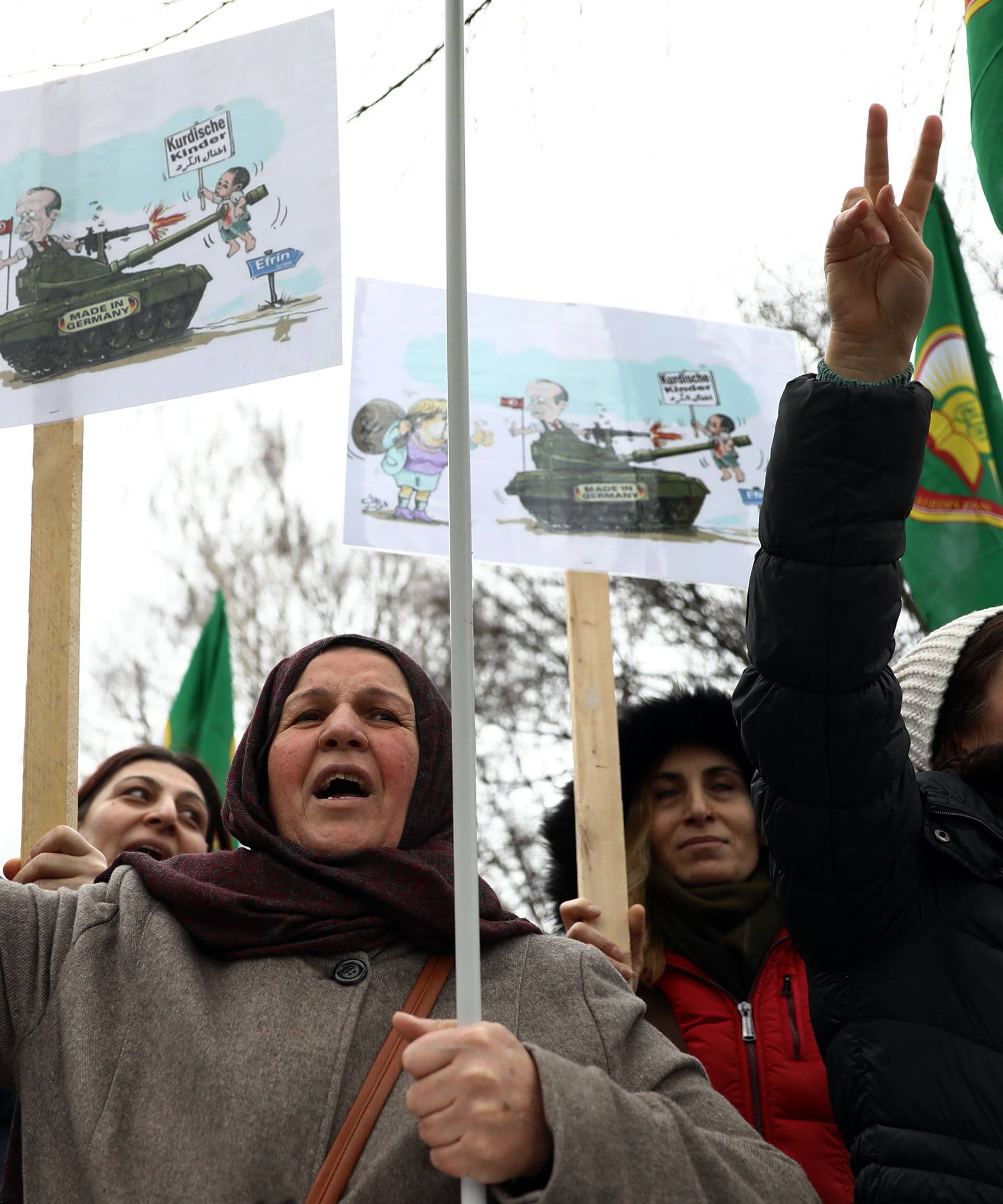 Pro-Kurdish protesters attend a demonstration outside the Turkish Embassy in Berlin