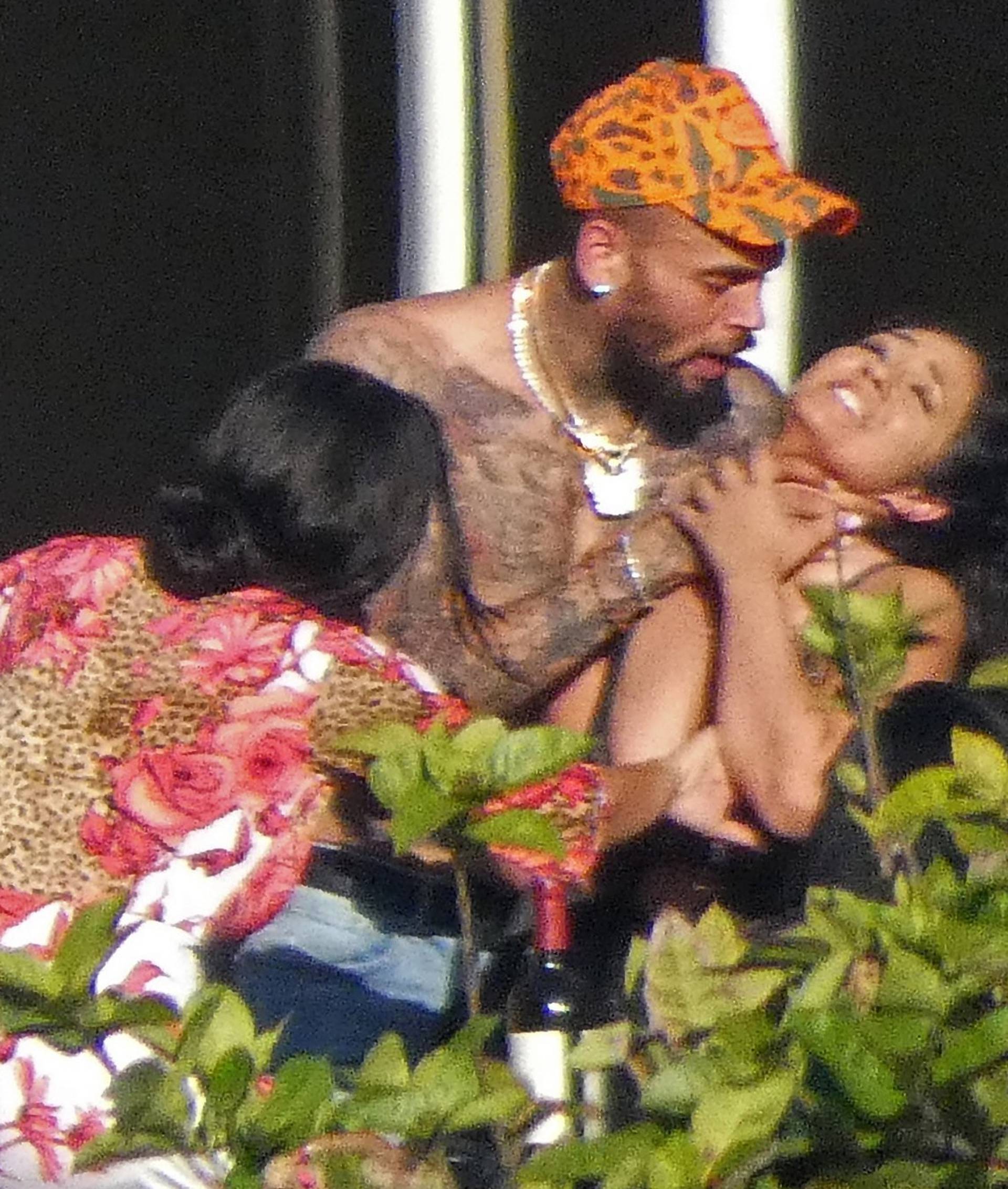 EXCLUSIVE: Chris Brown Puts Hands on Woman's Neck But They Say it's Just Horseplay