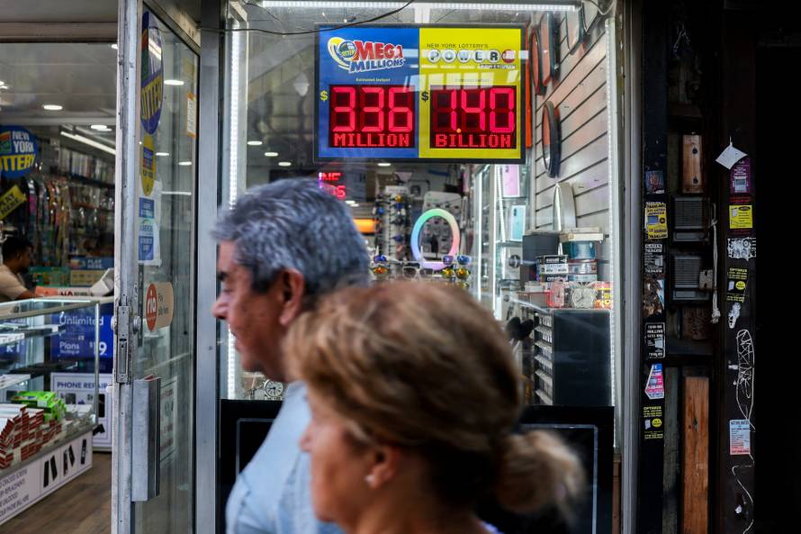 Sign shows the $1.4 billion jackpot in the Powerball lottery drawing in New York