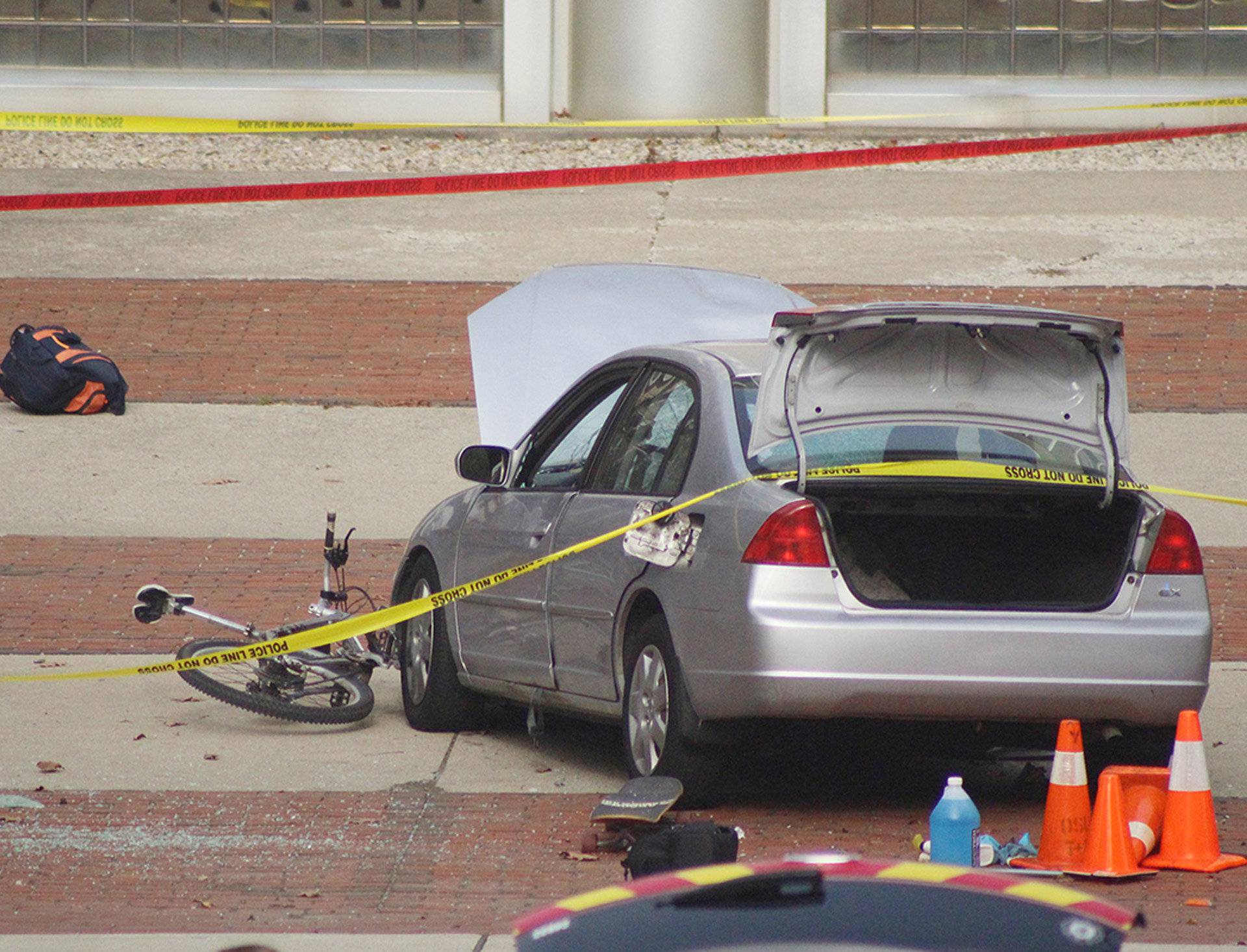 A car which police say was used by an attacker to plow into a group of students is seen outside Watts Hall on Ohio State University's campus in Columbus
