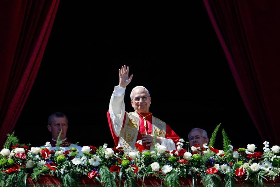 Pope Leo XIV delivers his "Urbi et Orbi" (To the city and the world) message from the main balcony of St. Peter's Basilica