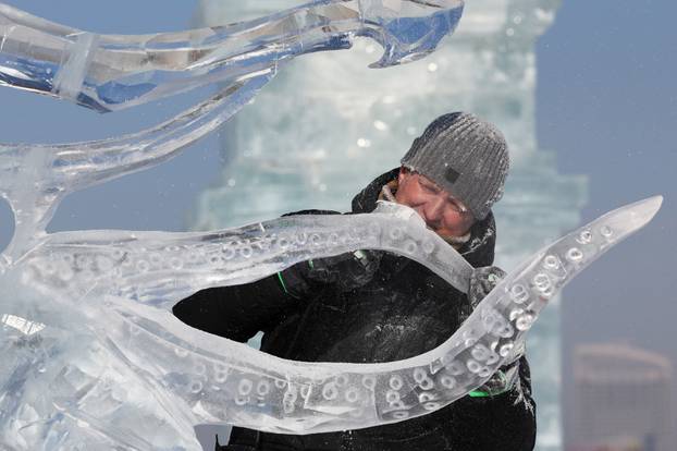A participant prepares for the ice sculpture contest during the annual Ice and Snow Festival in Harbin