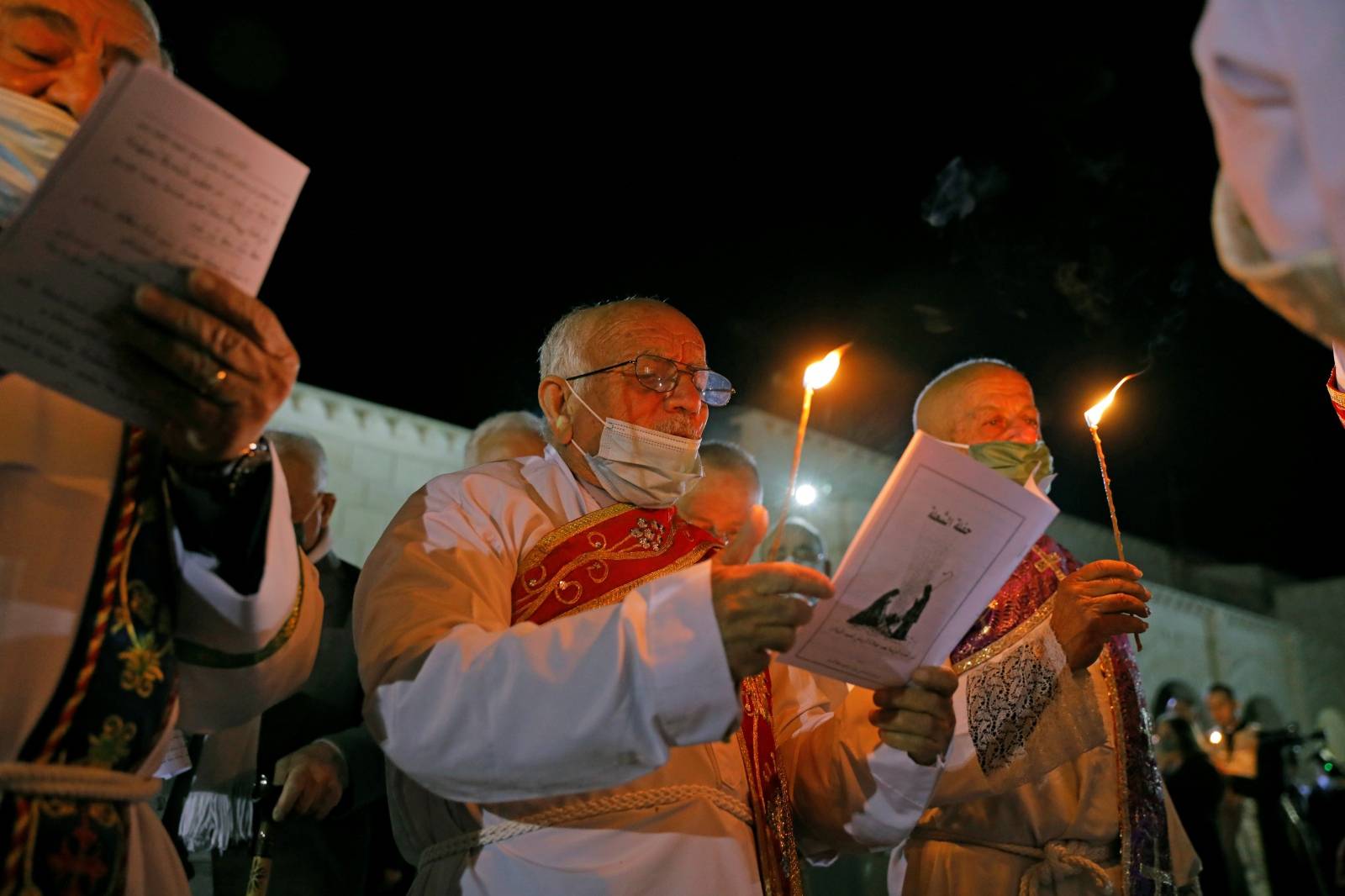 Iraqi Christians hold a mass on Christmas Eve