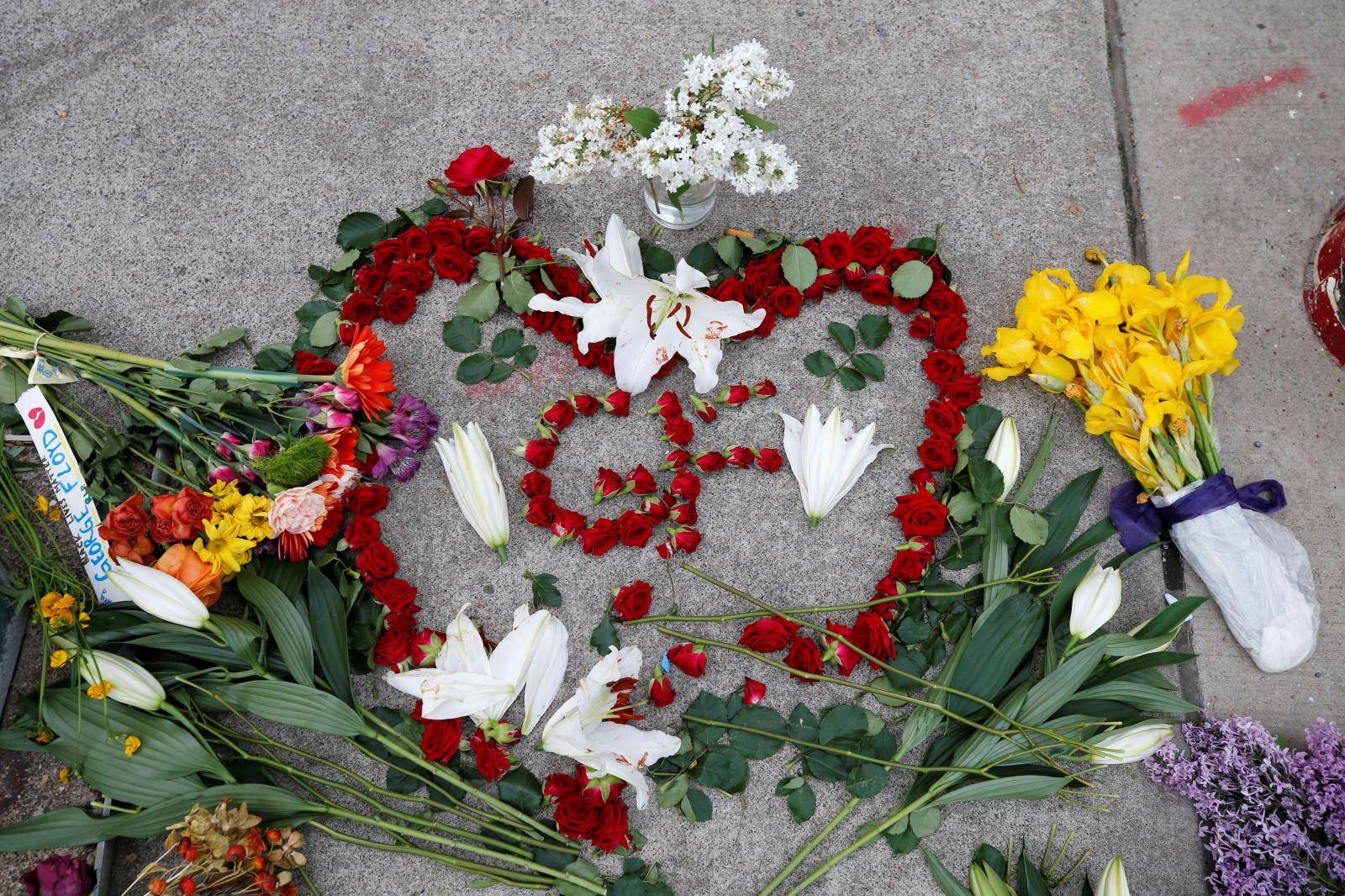 Protesters gather at the scene where Floyd was pinned down by a police officer in Minneapolis