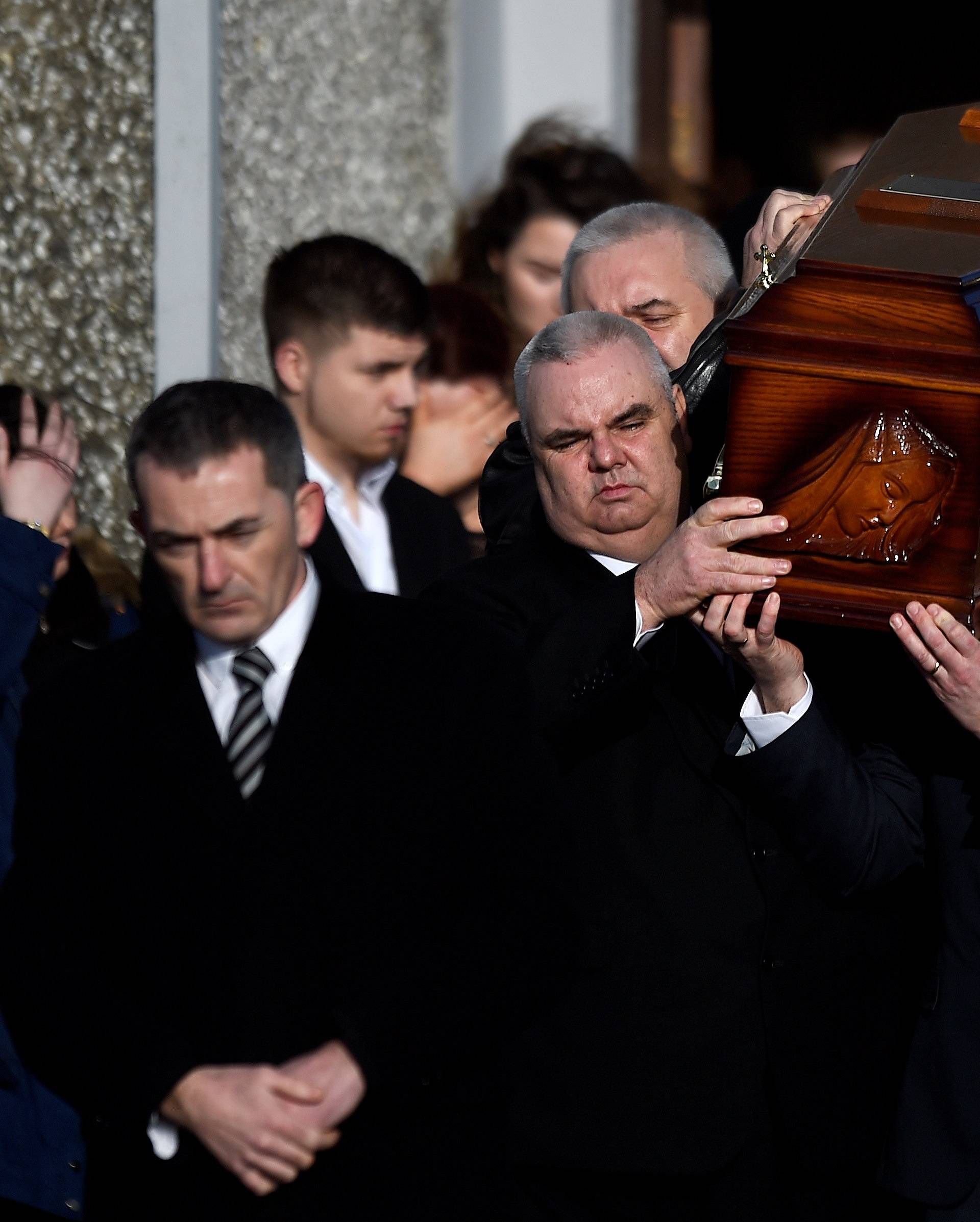 Dolores O'Riordan's coffin is carried out of her funeral at St Ailbe's Church in Ballybricken