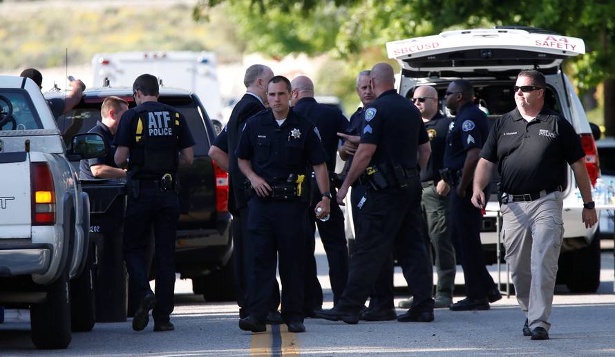 Police officers are pictured after a shooting at North Park Elementary School in San Bernardino