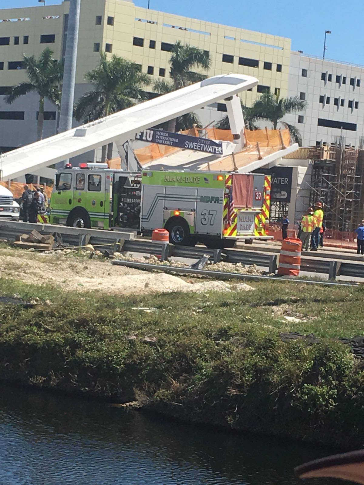Emergency crews respond to the scene of a collapsed pedestrian bridge at Florida International University in Miami