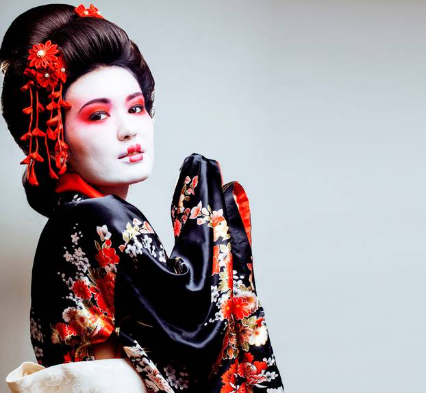young pretty geisha in kimono with sakura and red decoration des