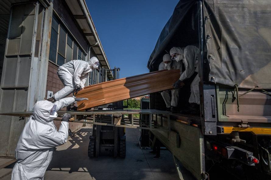 San Pietro bridge. Military and medical personnel of the Army together with the Carabinieri transport the coffins with the use of six trucks from a depot in Ponte San Pietro due to emergency COVID19 Coronavirus