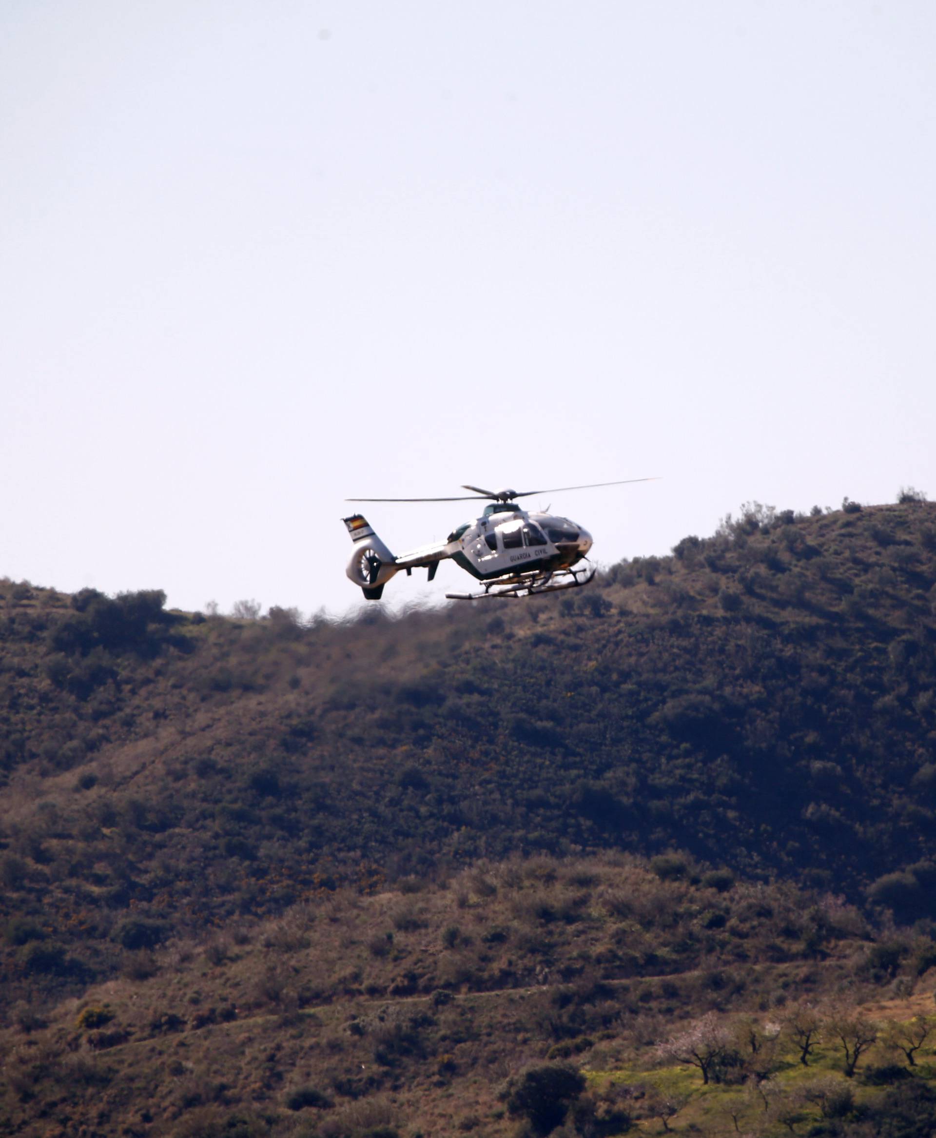 A Spanish Civil Guard helicopter lands carrying boxes with explosives picked in Sevilla at the area where Julen, a Spanish two-year-old boy, fell into a deep well, in Totalan