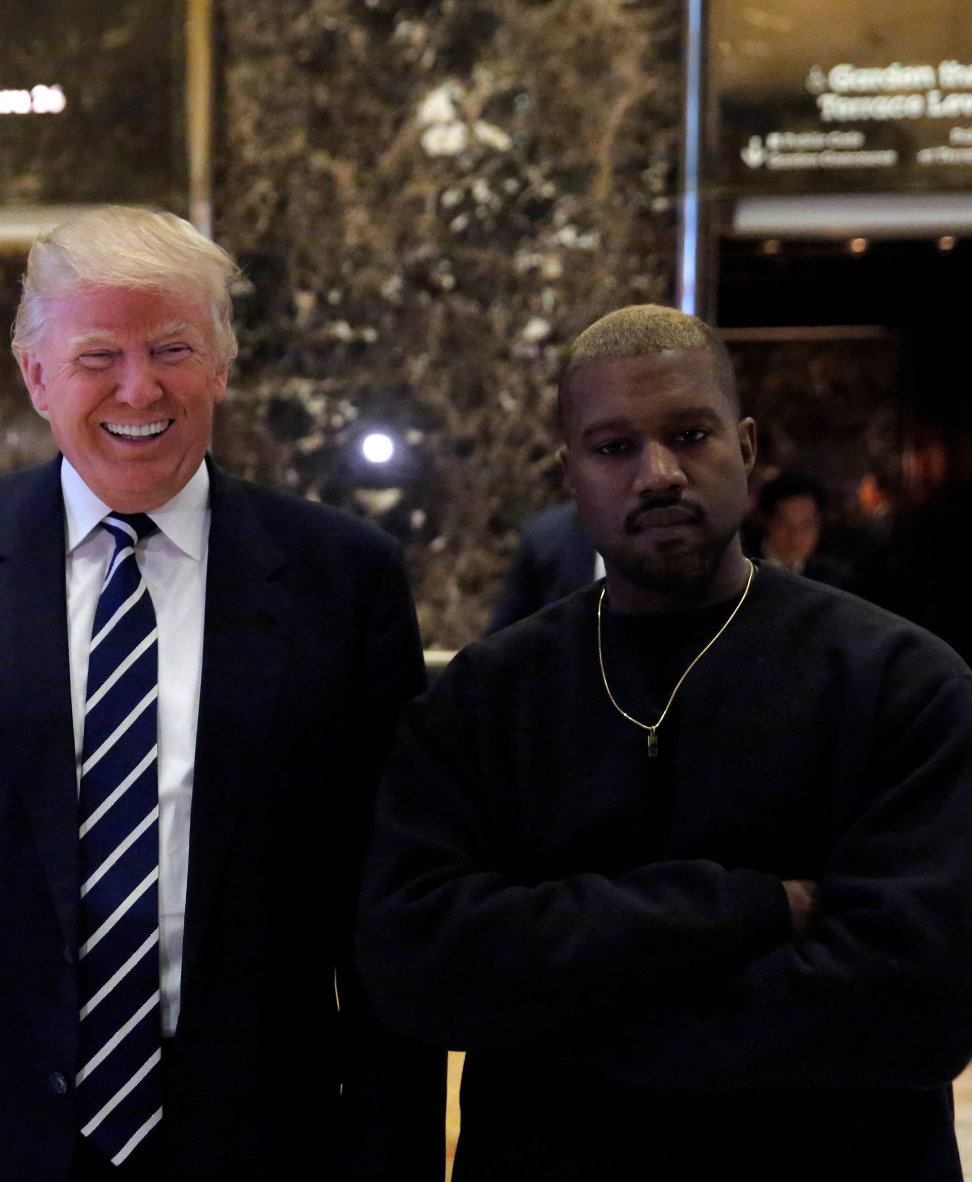 U.S. President-elect Donald Trump and musician Kanye West pose for media at Trump Tower in Manhattan, New York City