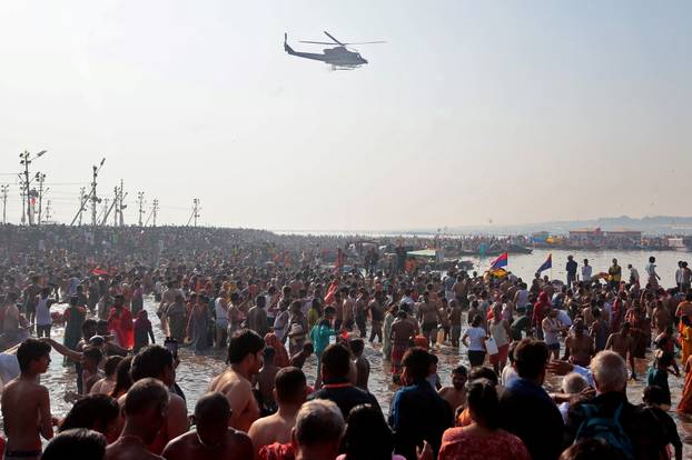 Devotees take a dip at Sangam during "Maha Kumbh Mela" in Prayagraj