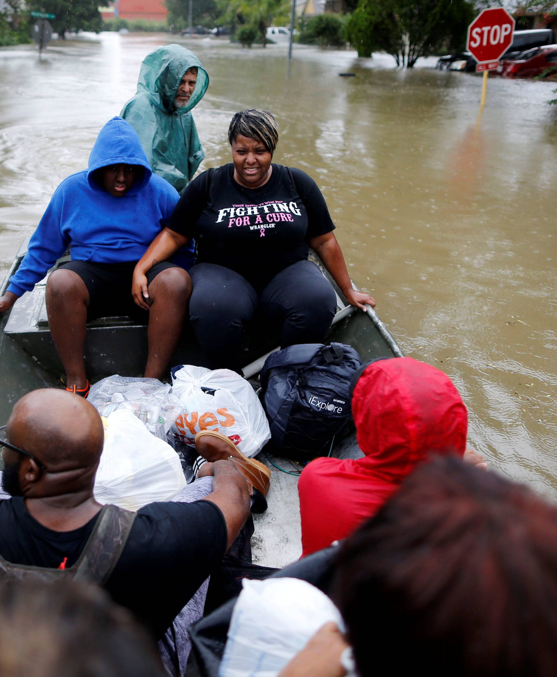 Hawkins family is rescued from the flood waters of Tropical Storm Harvey in Beaumont Place, Houston