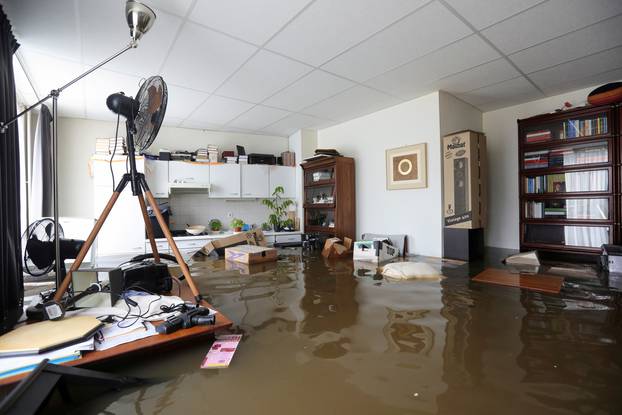 FILE PHOTO: A view shows flooded interior of a house in Guelle