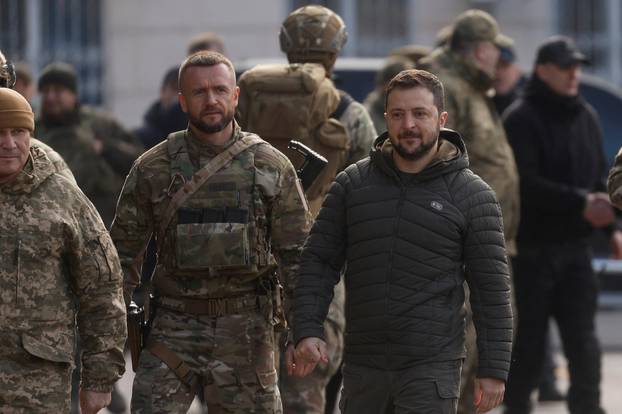 Ukraine’s President Zelenskiy arrives for a flag rising in central Kherson